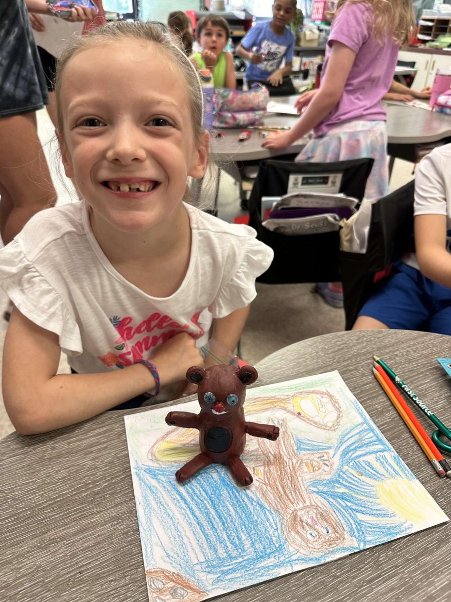 Ceramics III and 1st grade students collaborate on monster art. May 2024.