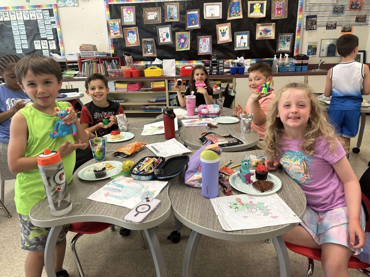 Ceramics III and 1st grade students collaborate on monster art. May 2024.