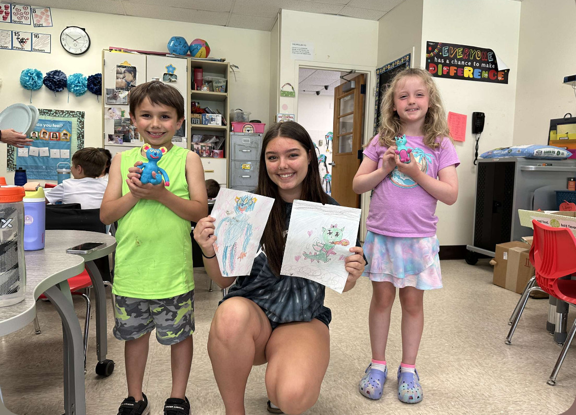 Ceramics III and 1st grade students collaborate on monster art. May 2024.