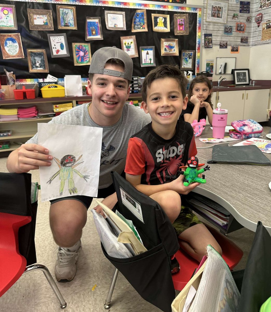 Ceramics III and 1st grade students collaborate on monster art. May 2024.