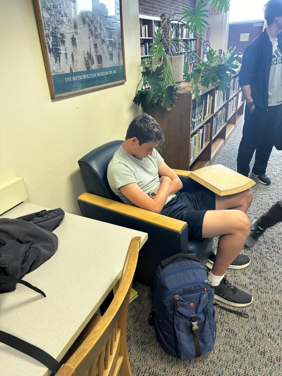 Isaac Gruneich sleeping in the library after a lack of sleep the night before.