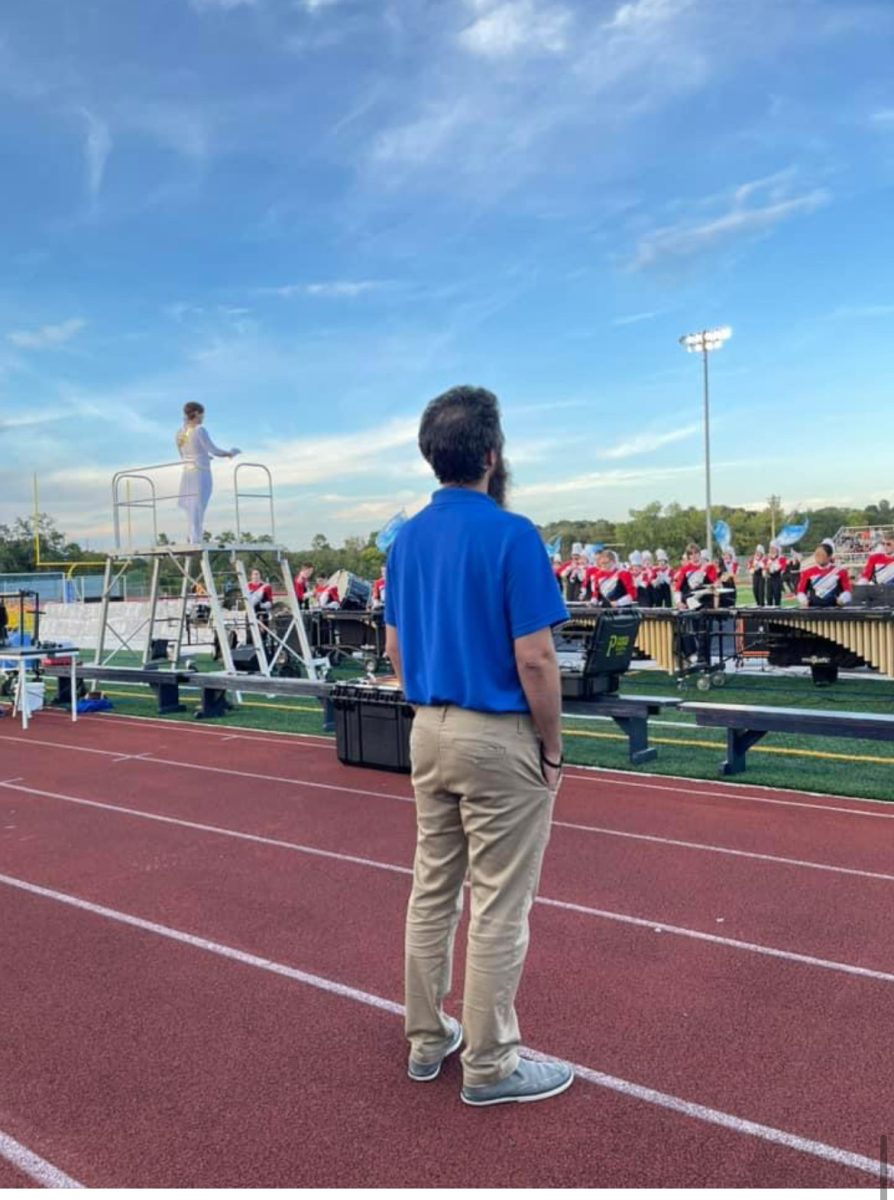 Mr. Fabbio leads the band on Don Edick field. Photo submitted by Ms. Menard.