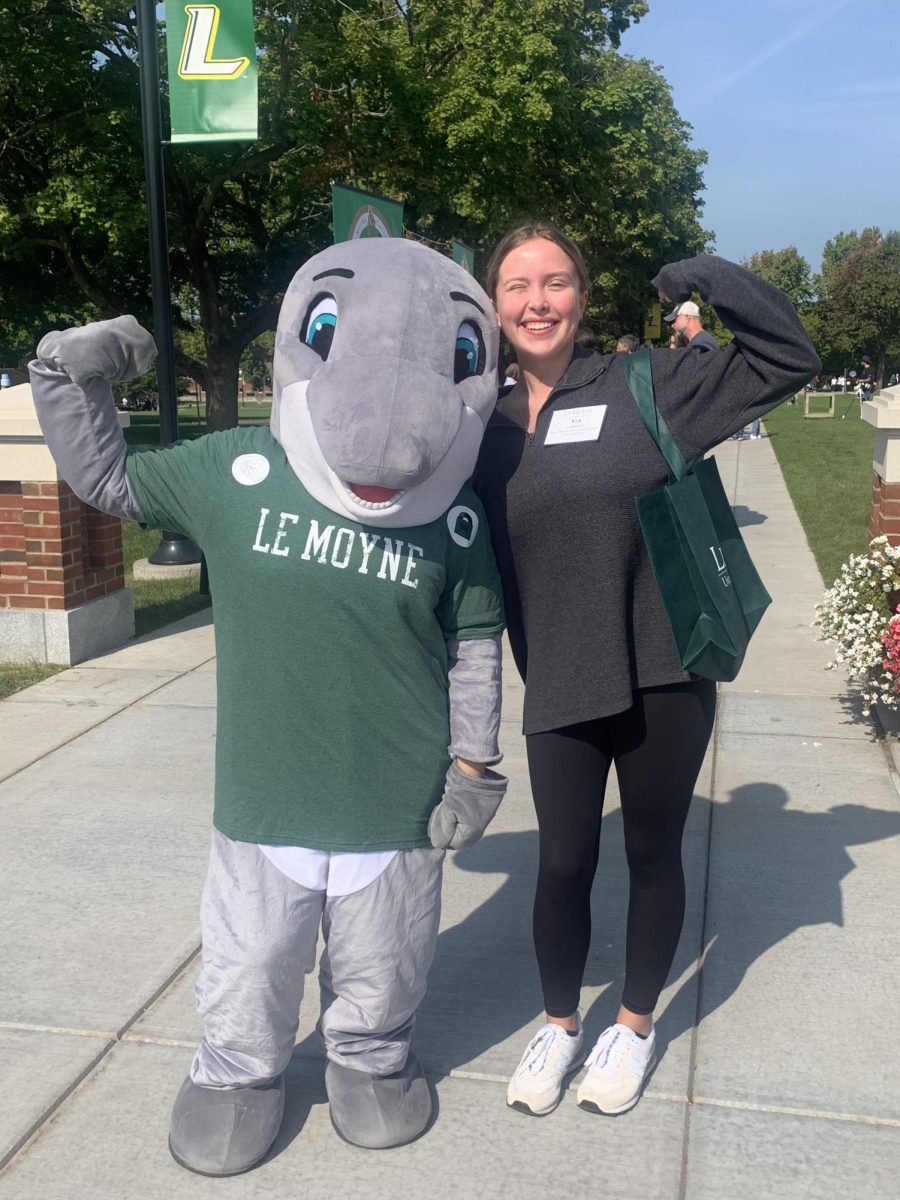 Student Ava Lakeman with the Le Moyne College mascot at her college visit there.