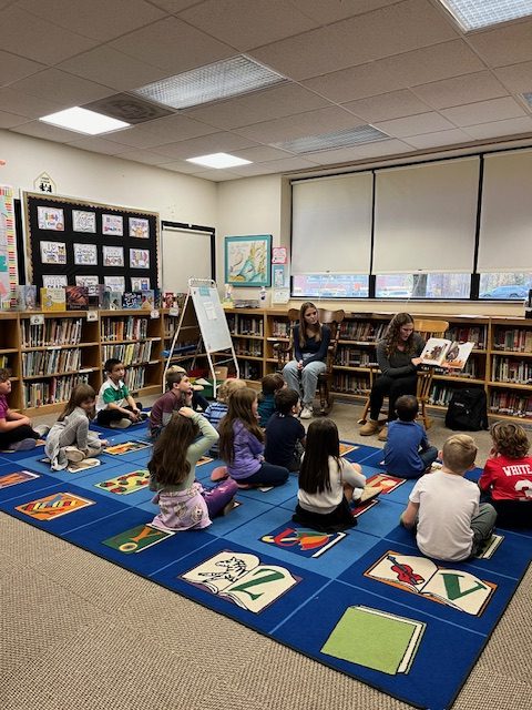 The book club reads to  elementary students.
