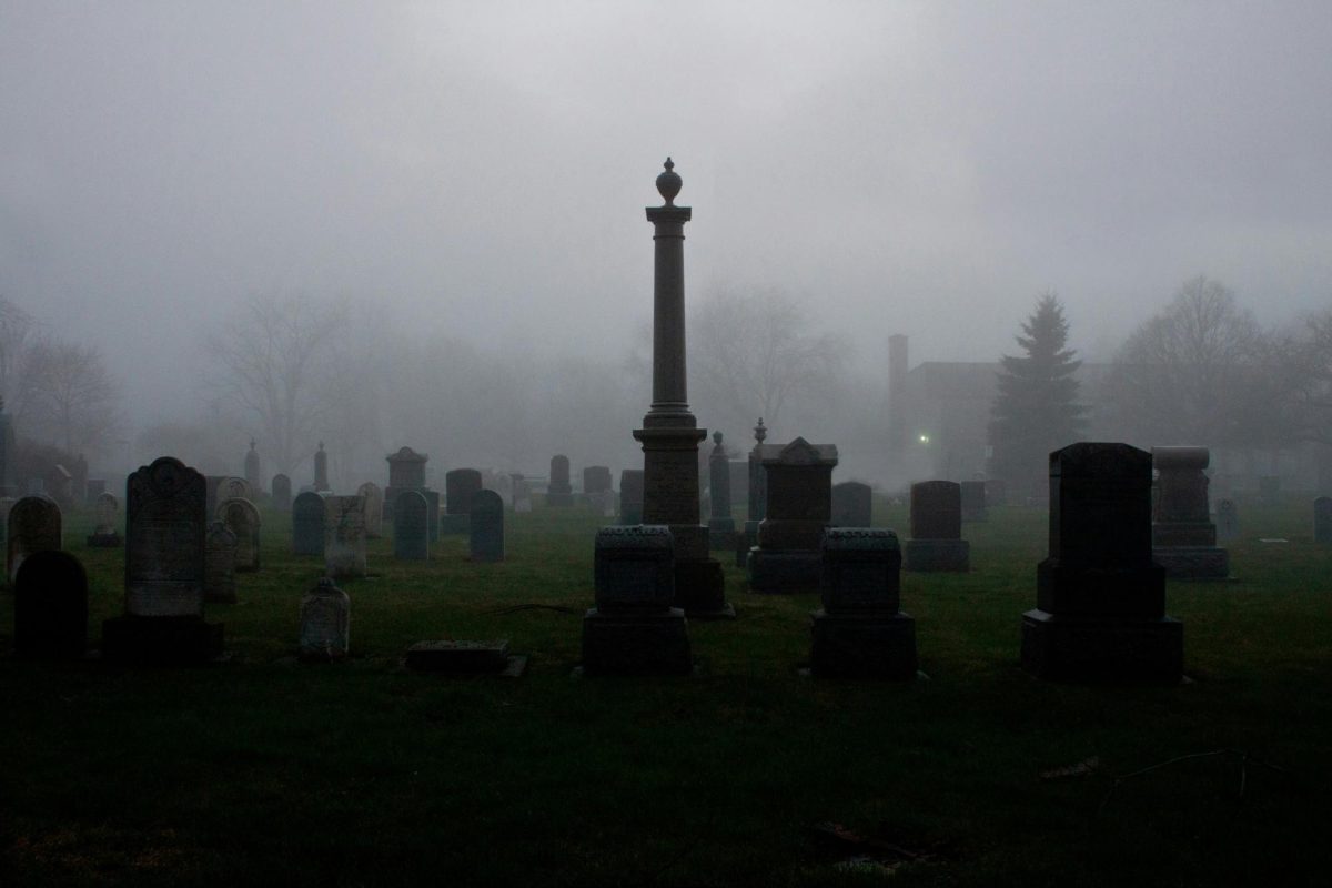 A dark and foggy cemetery. Image courtesy of Unsplash