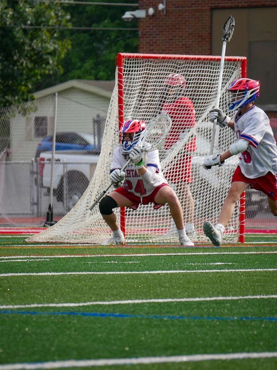 Goalie Will Picolla tracks the ball in a game last year at New Hartford's Don Edick Field.