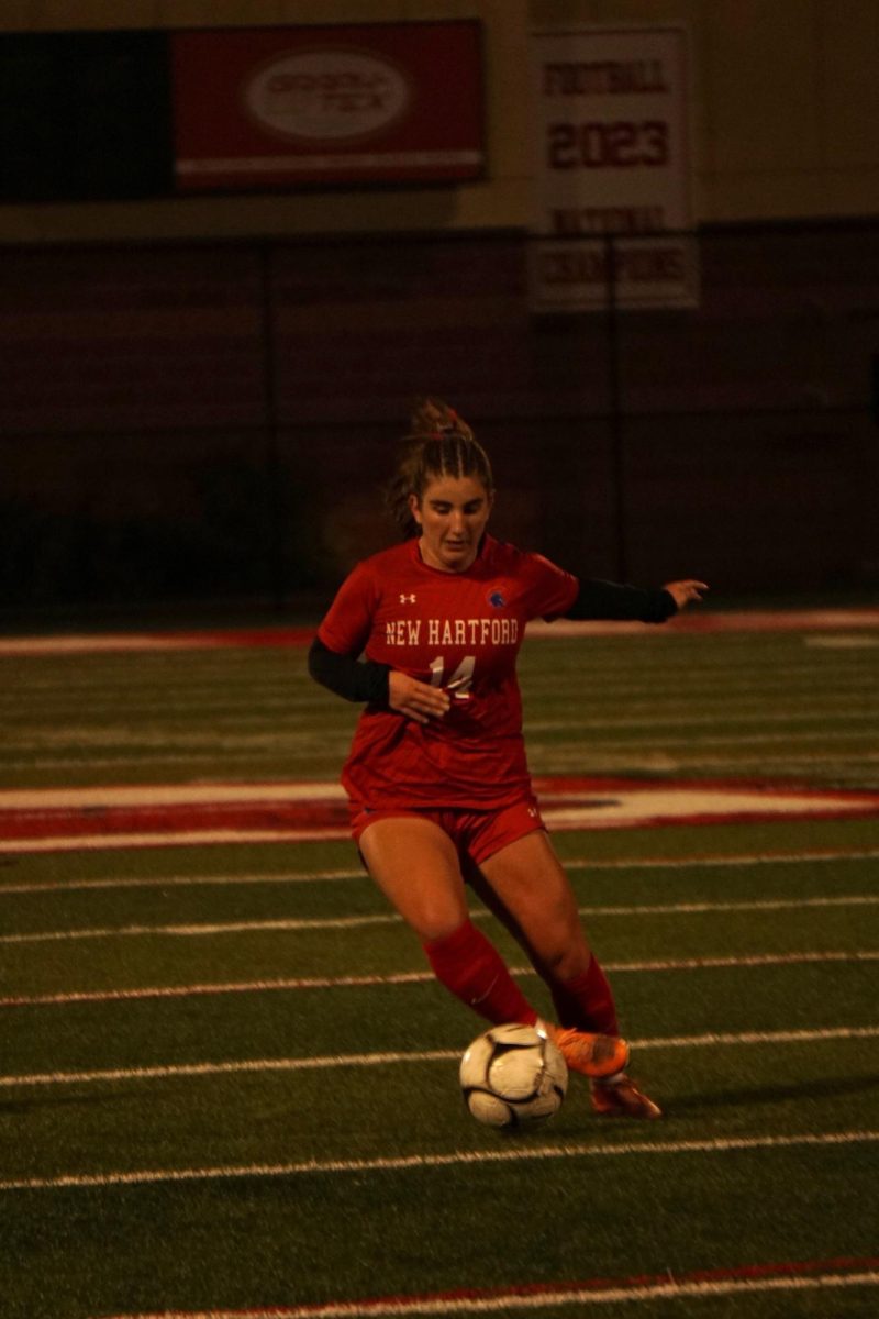 Julia Peplinski dribbles the ball at the sectional match with Jamesville-Dewitt. 