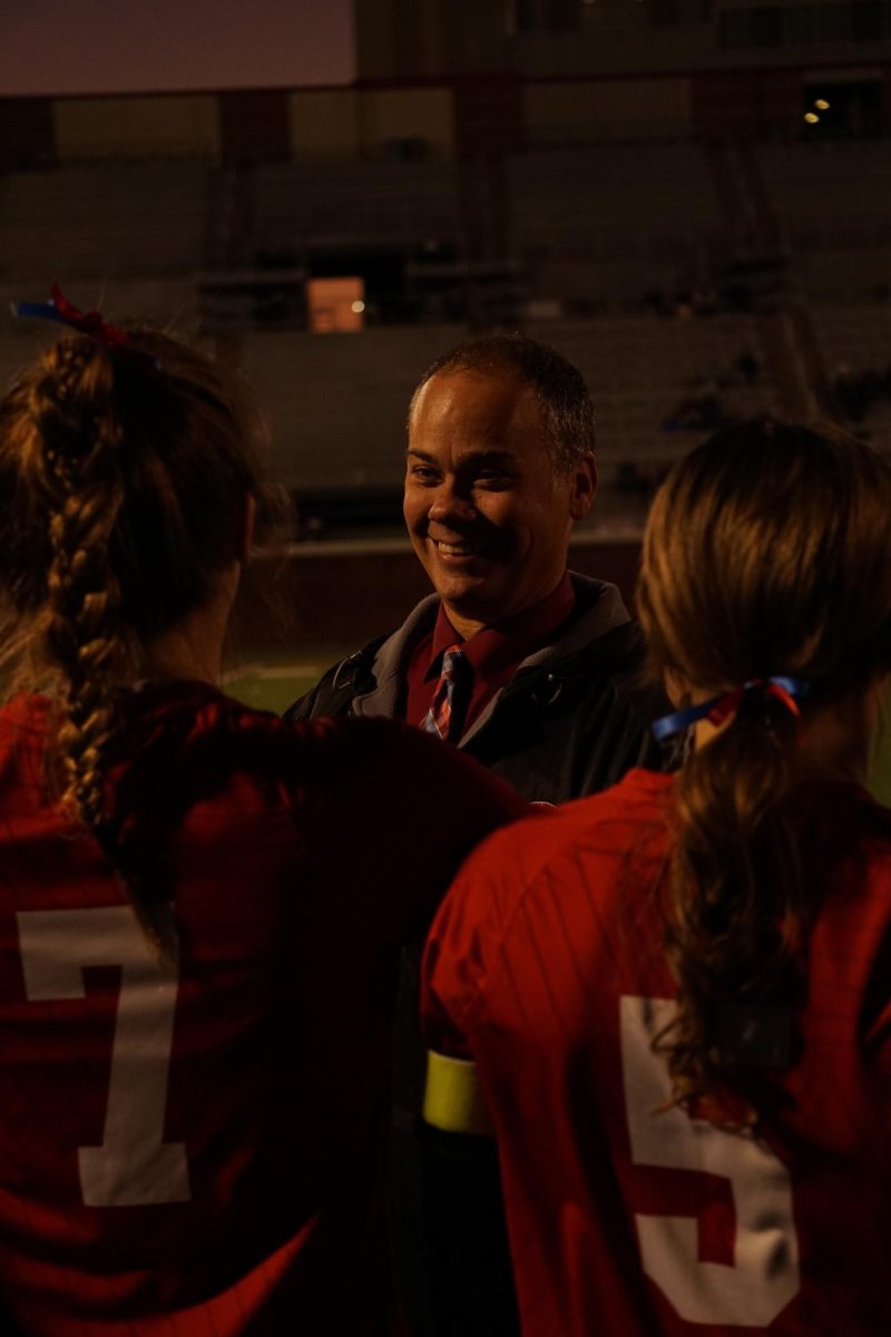 Coach DuRoss celebrates the win with his players. The Girls Varsity Soccer team defeated Jamesville-Dewitt to win the section title on November 2, 2025. The team extends their winning streak to five consecutive section titles.
