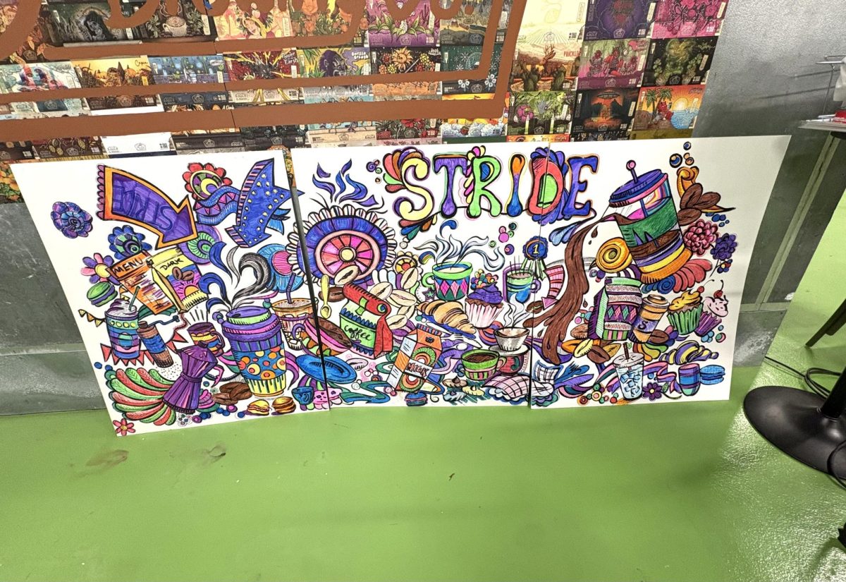 The finished Art Club mural set up against the fridge at Stride Coffee Roasters. 