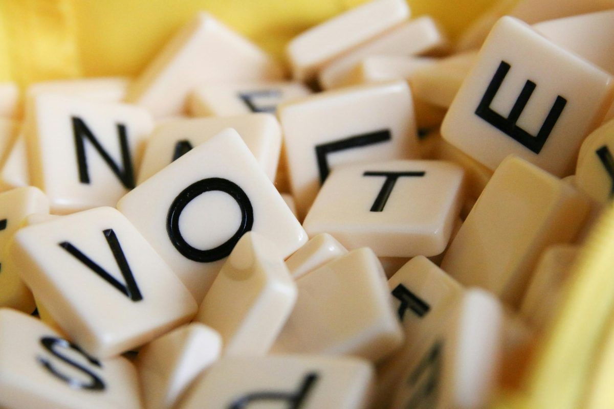 Picture of Scrabble tiles that spell out "Vote".