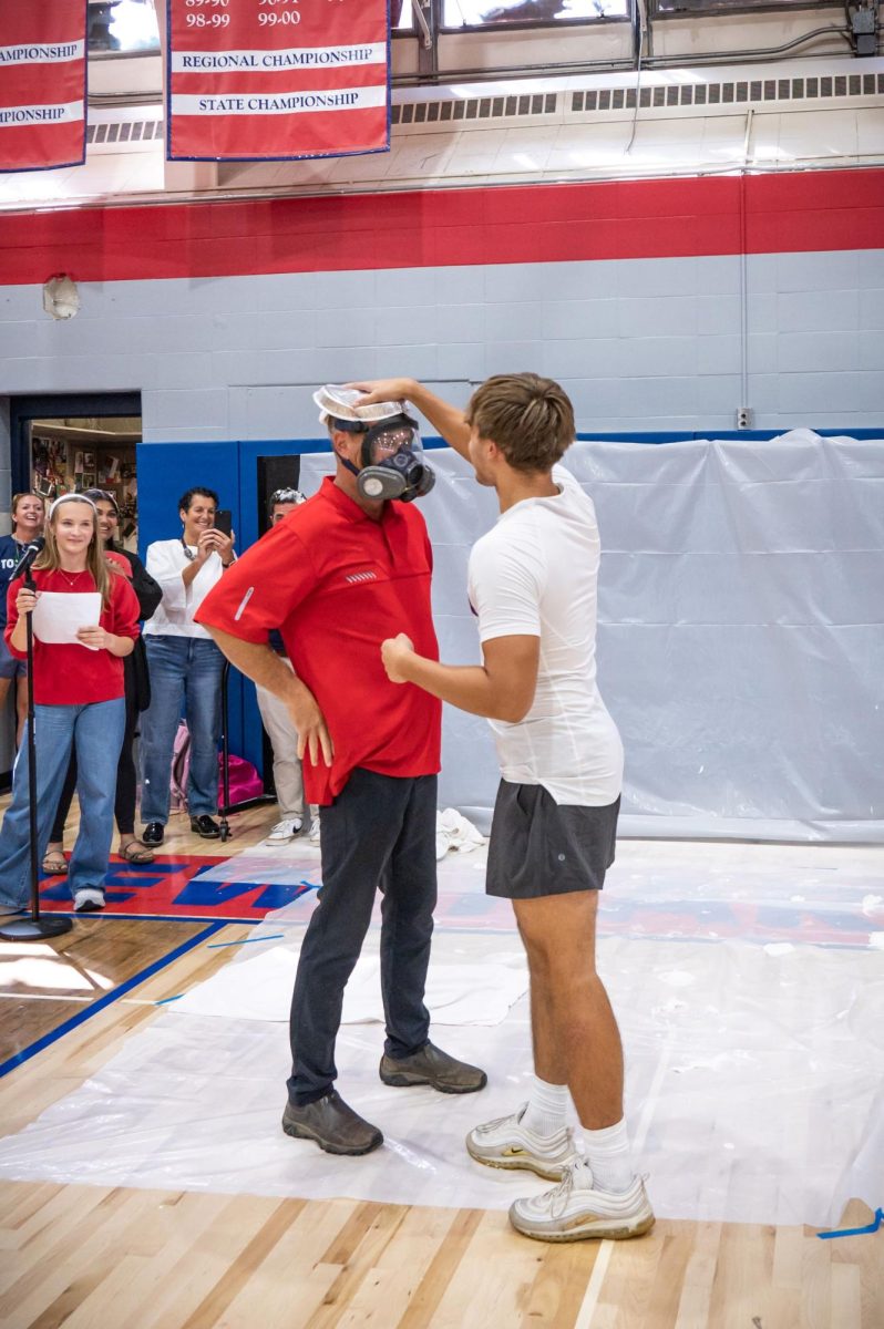 Jonah Snizek pies his father, Mr. Snizek in the face at the pep rally.  Fall 2026. 